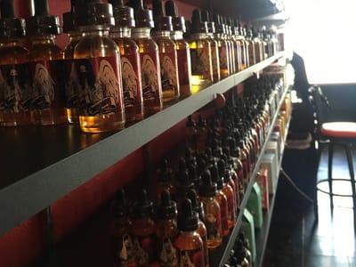 Metric Glass & Smoke Shop and Vape Certified, Shaved Ice Sno Cones and 100% Authentic Sneakers